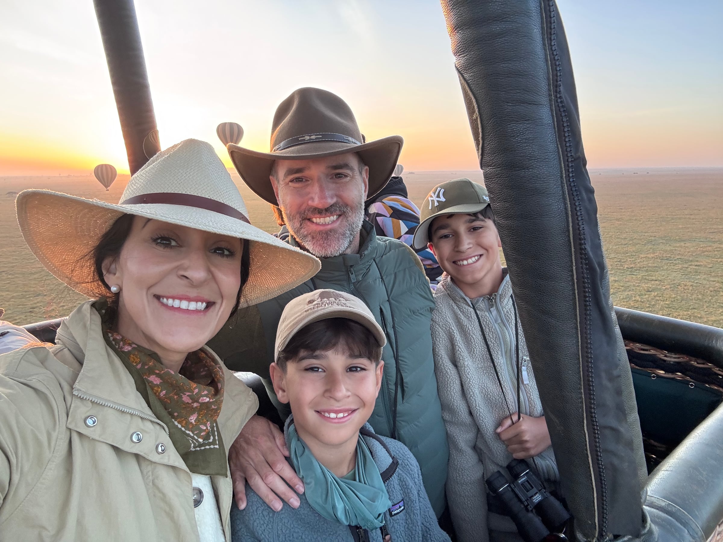 The whole family at sunrise in a hot air balloon over the Serengeti