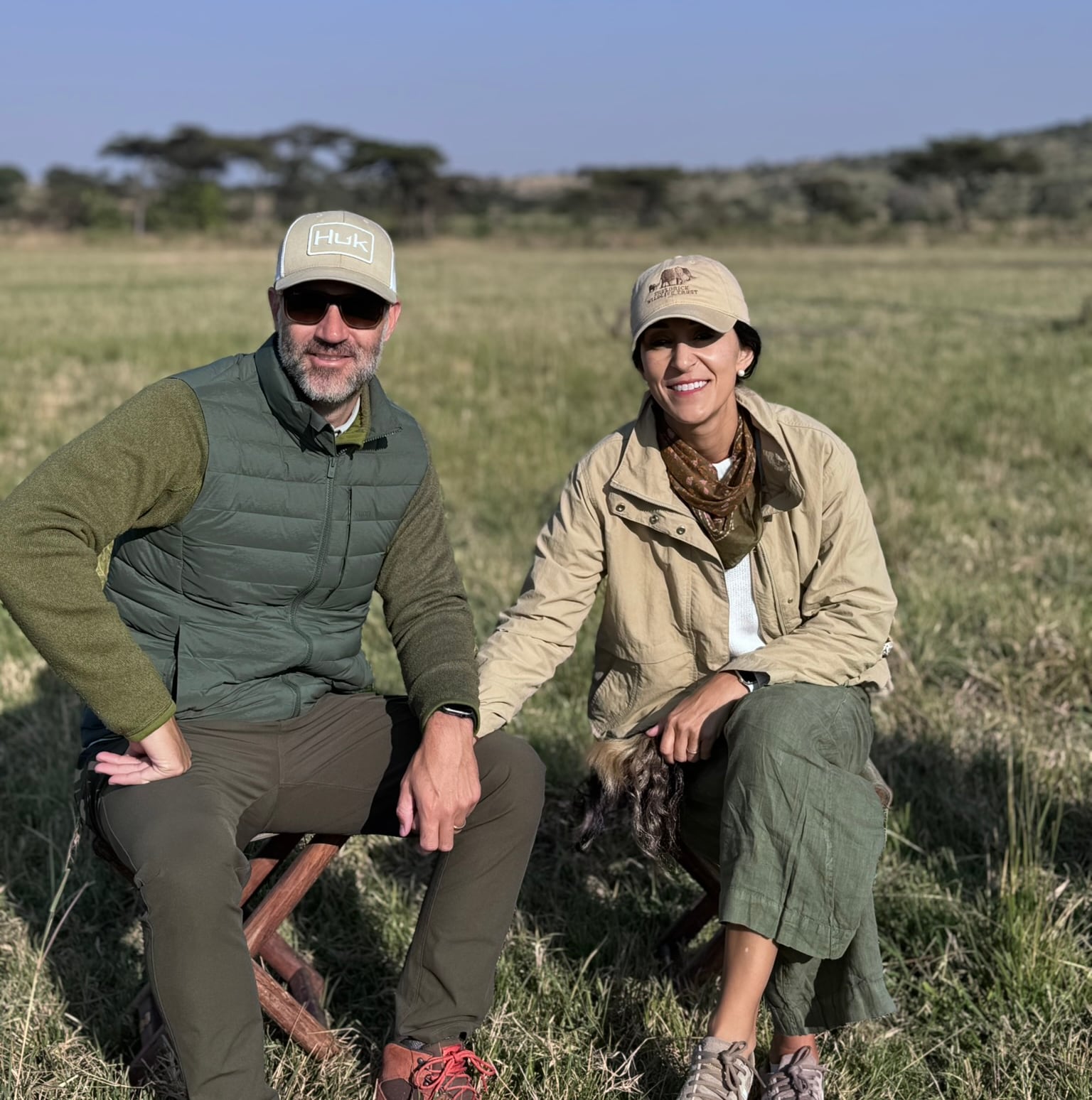 Kneeling together on the Serengeti savanna