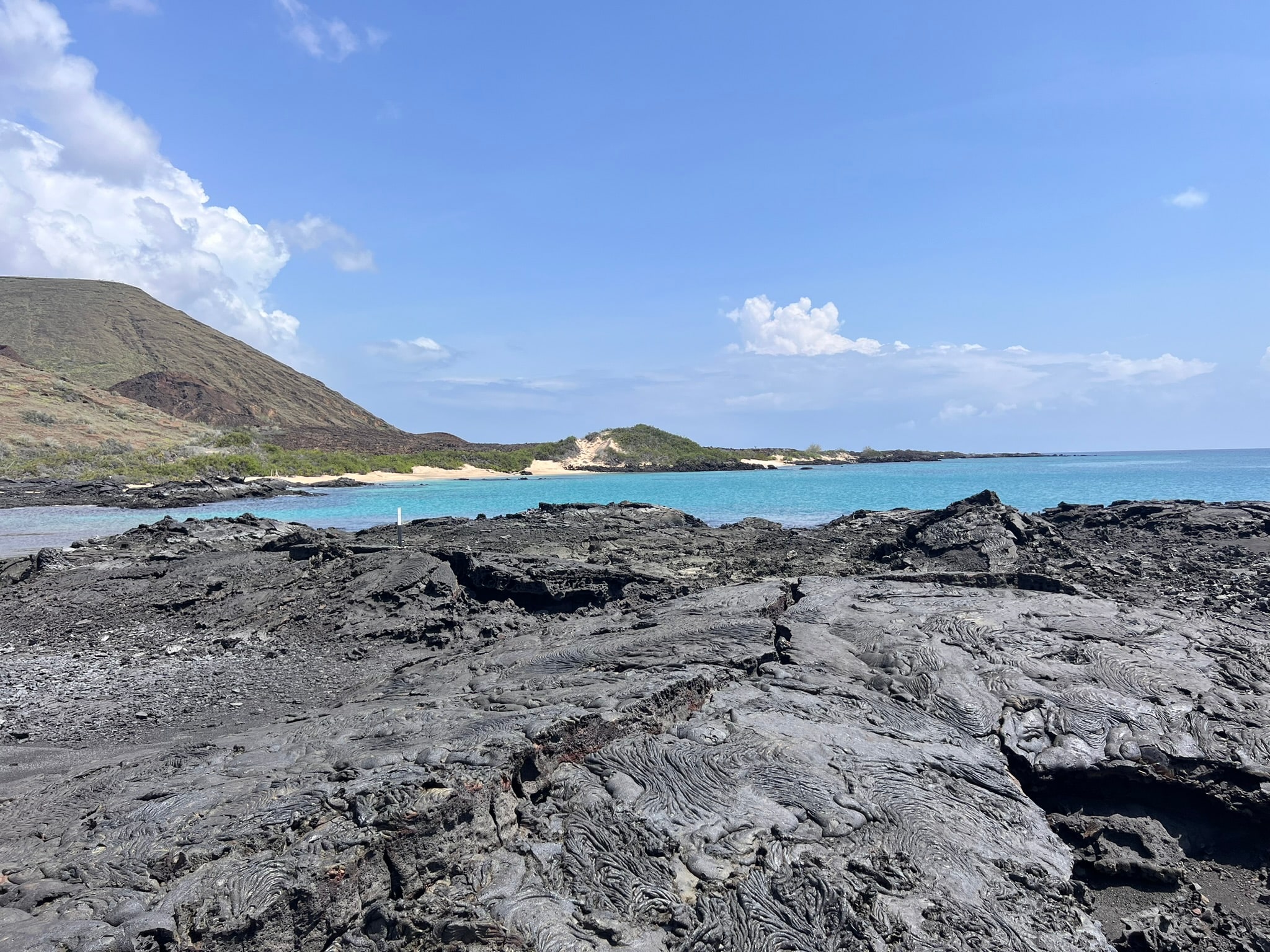 Turquoise water along a volcanic coastline